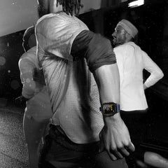 Person wearing a smartwatch with a blurred background