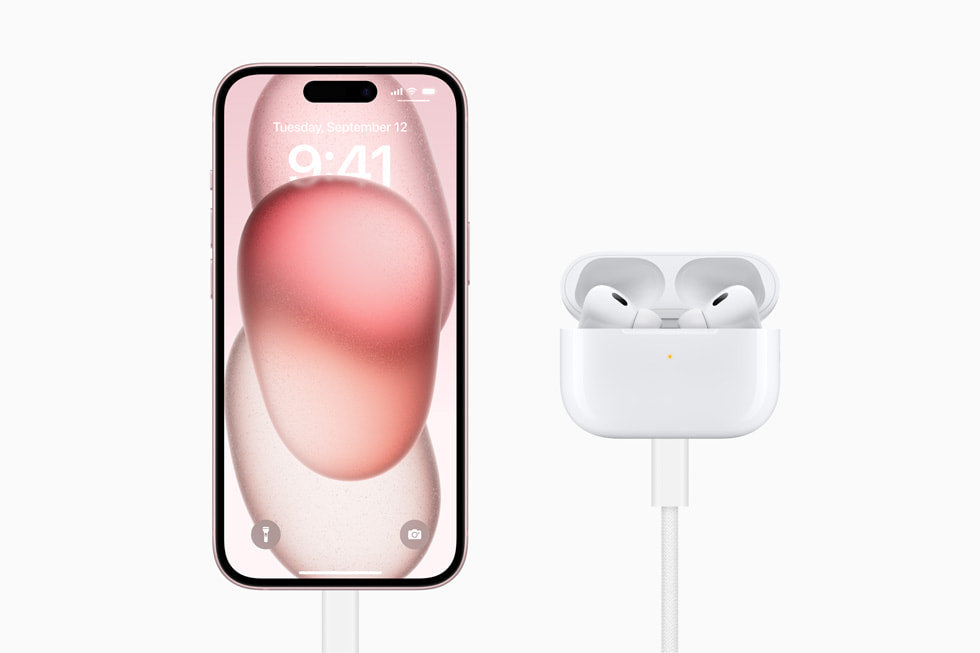 Lifestyle: iPhone 15 128GB Pink charging over USB-C with AirPods Pro