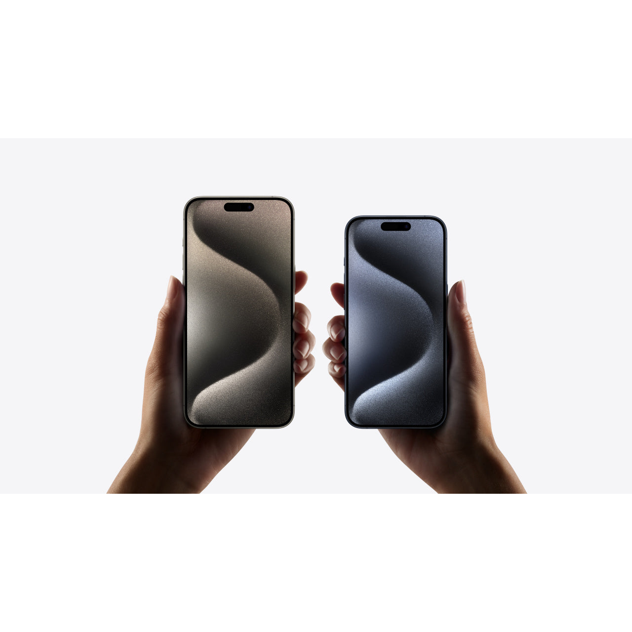Lifestyle: holding iPhone 15 Pro Max (Blue Titanium) and iPhone 15 Pro
